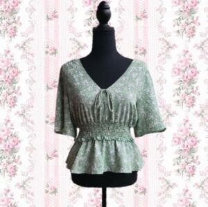 Mint green floral blouse.